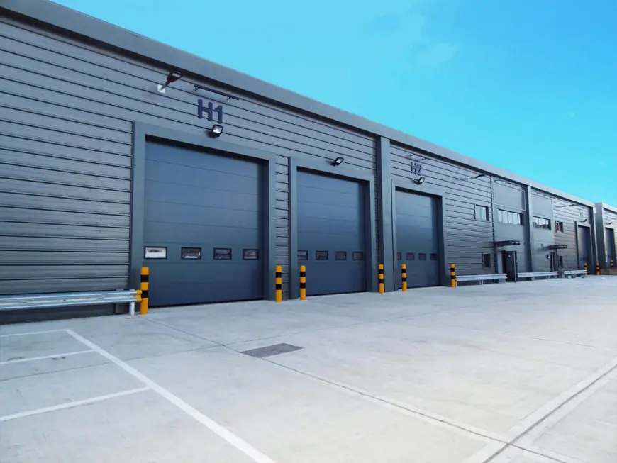 Transforming Industrial Spaces with Top-Notch Sectional Door Solutions: A Guide by Industrial Sectional Door