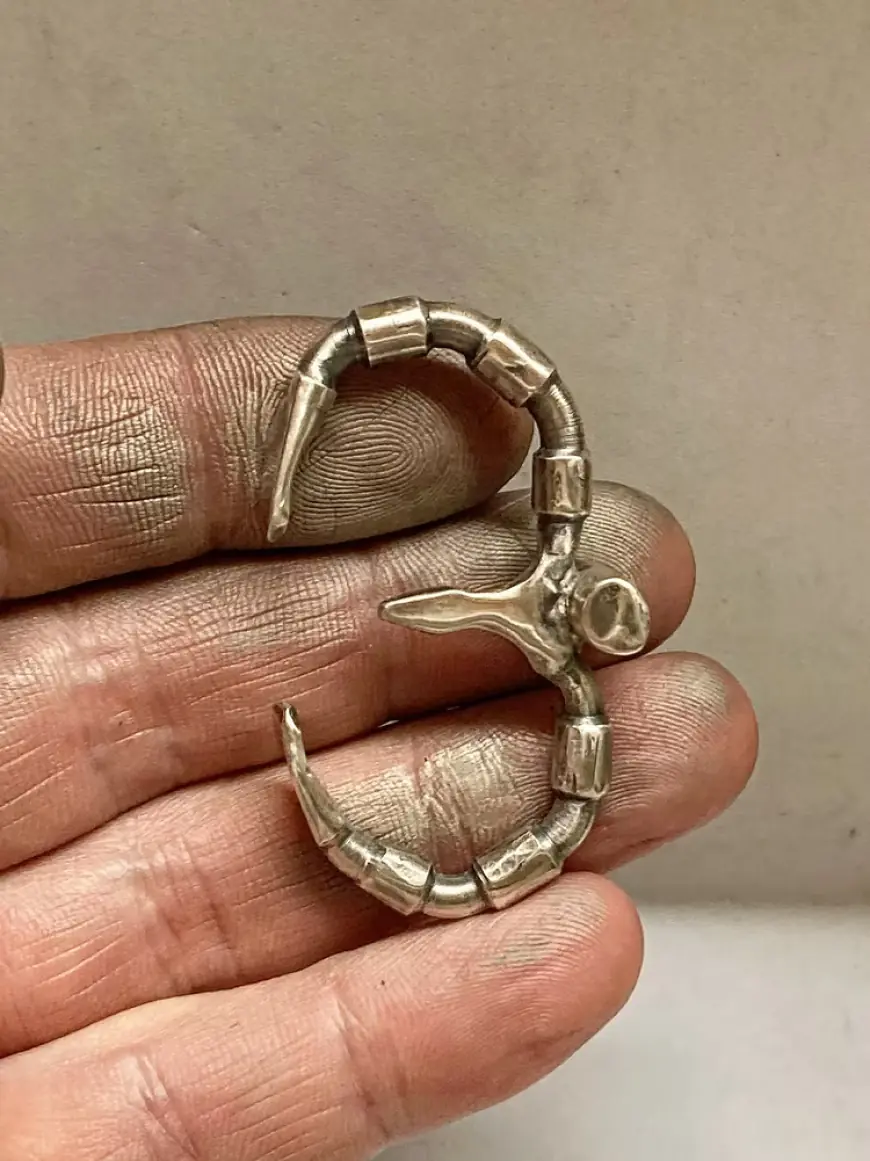 What Makes Men’s Angel Wing Necklaces and Double Finger Rings Symbolic and Stylish Accessories?